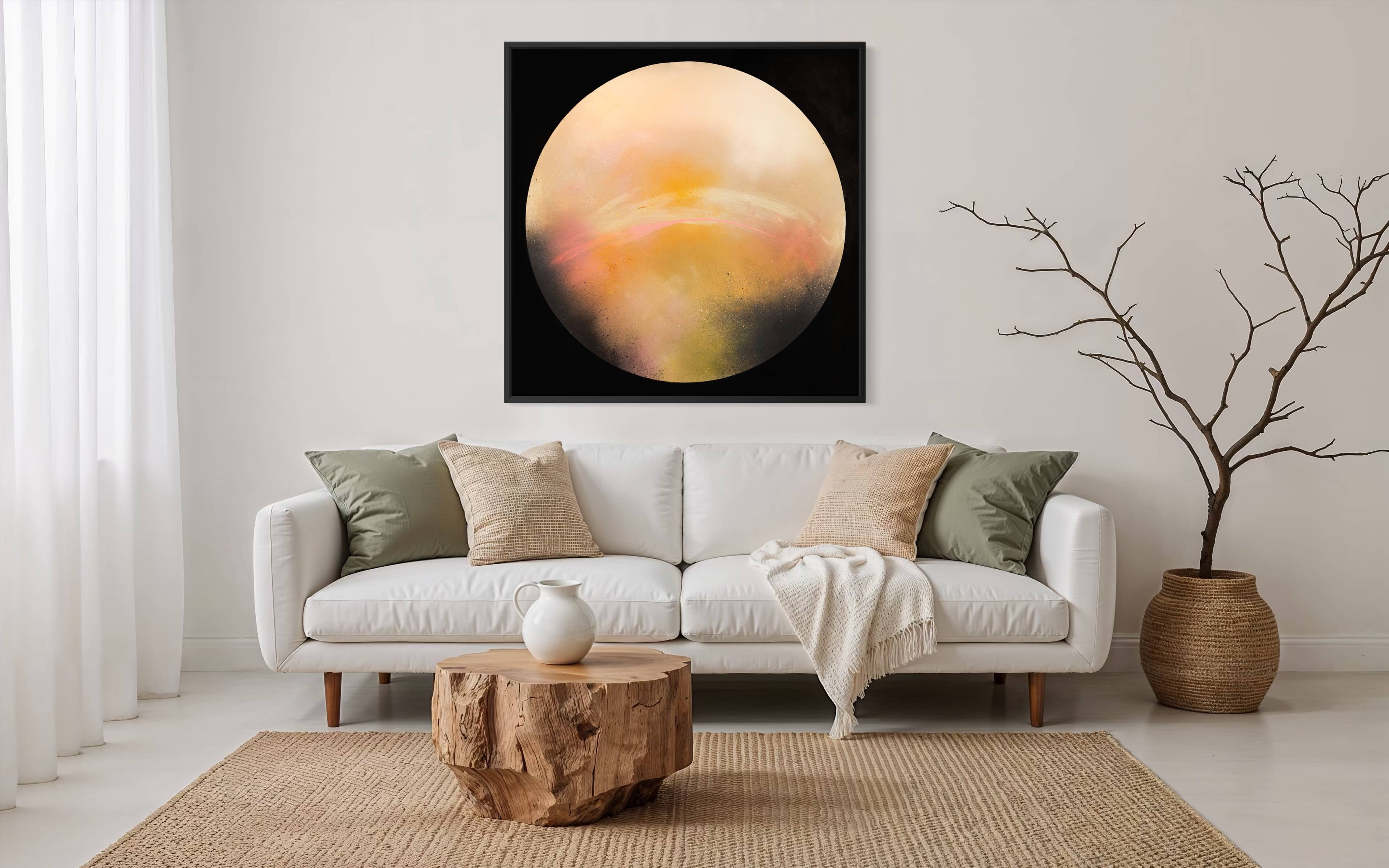 Minimalist living room with a white sofa, neutral cushions, and Kate Mayer's "Sun It Rises" on a circular plywood panel.