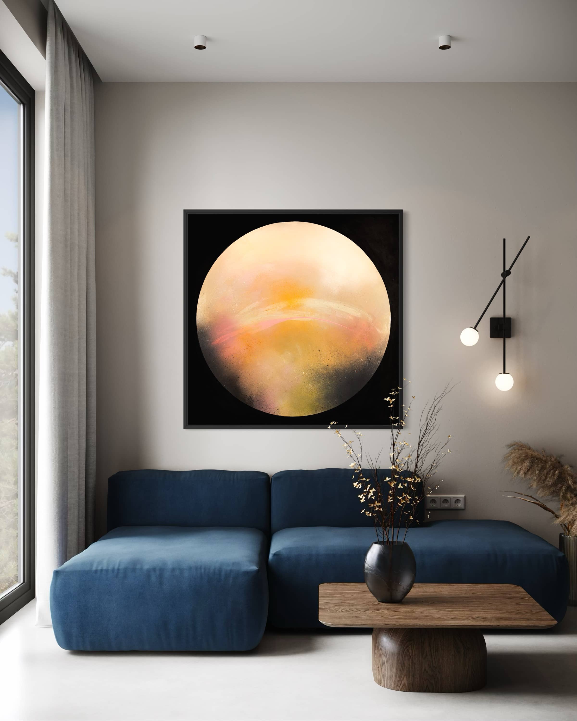 Modern living room with blue sectional, Kate Mayer’s Sun It Rises on wood panel, and wall-mounted light fixture.