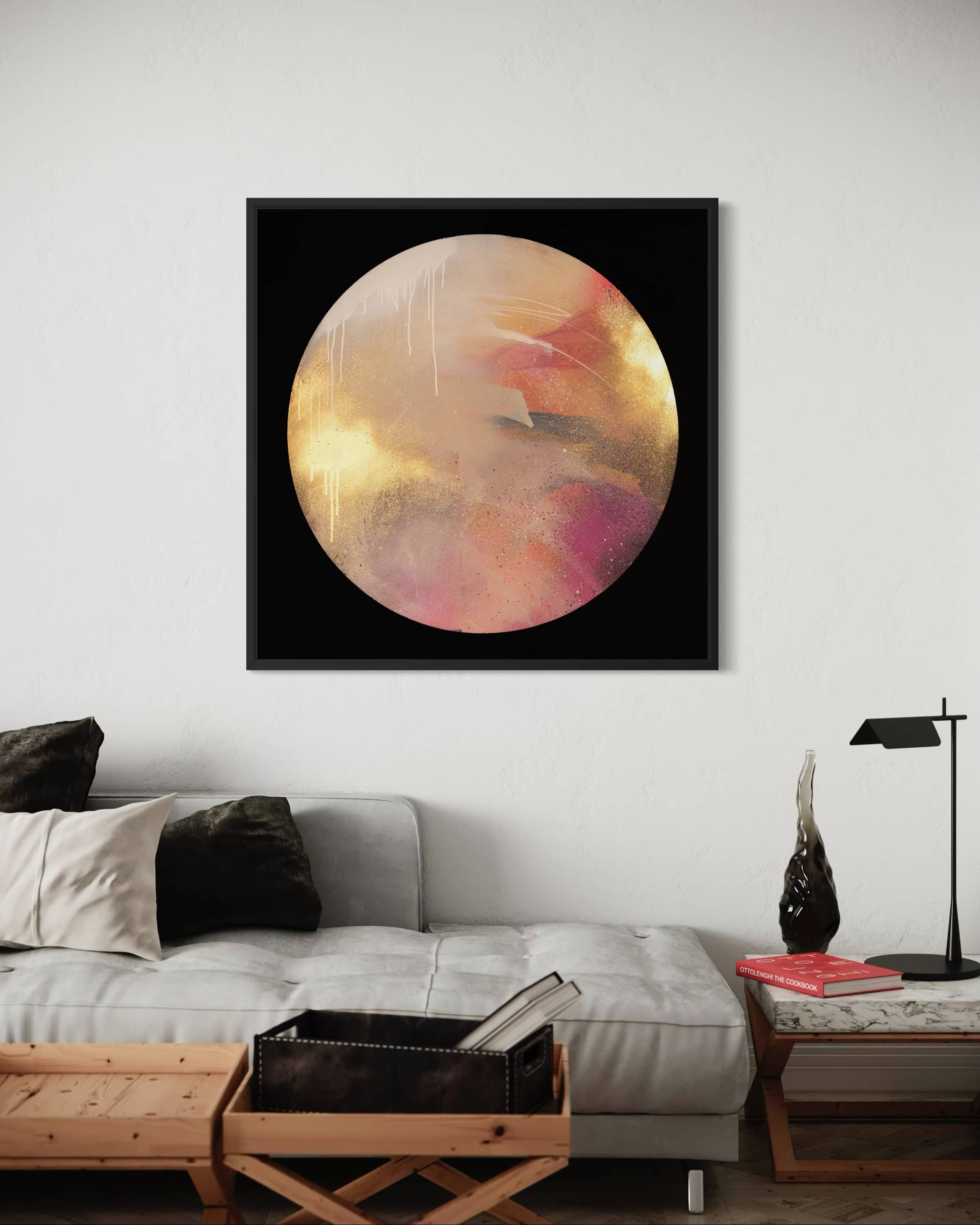 Where Love Lives" by Kate Mayer, an abstract acrylic in gold, pink & orange, hangs above a chic living room sofa.