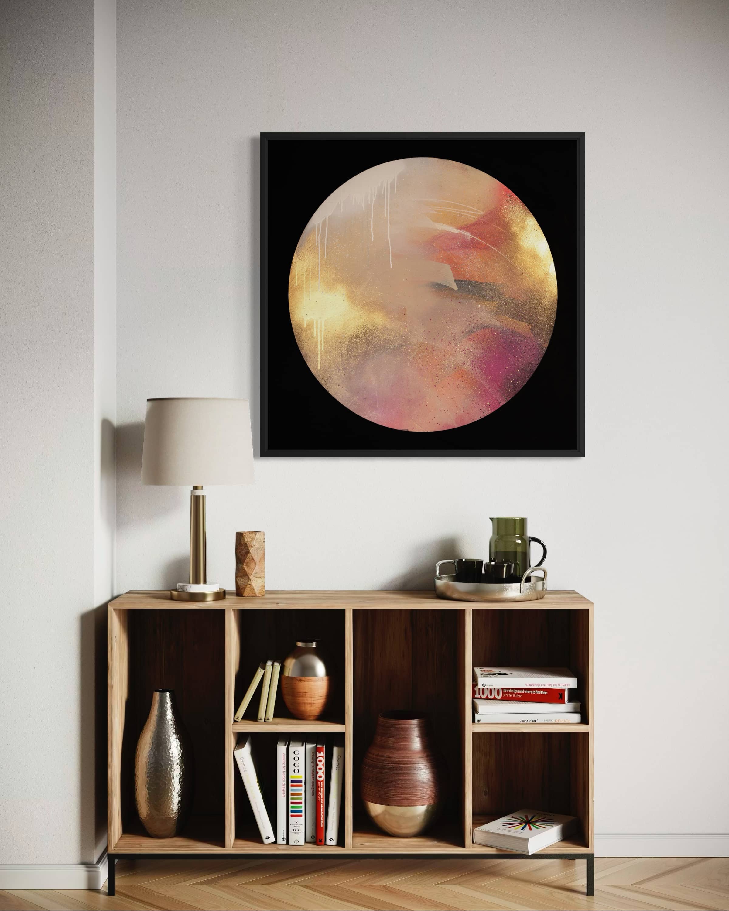 A modern living room with decor, a coffee set, and Kate Mayer’s "Where Love Lives" painting on the wall.