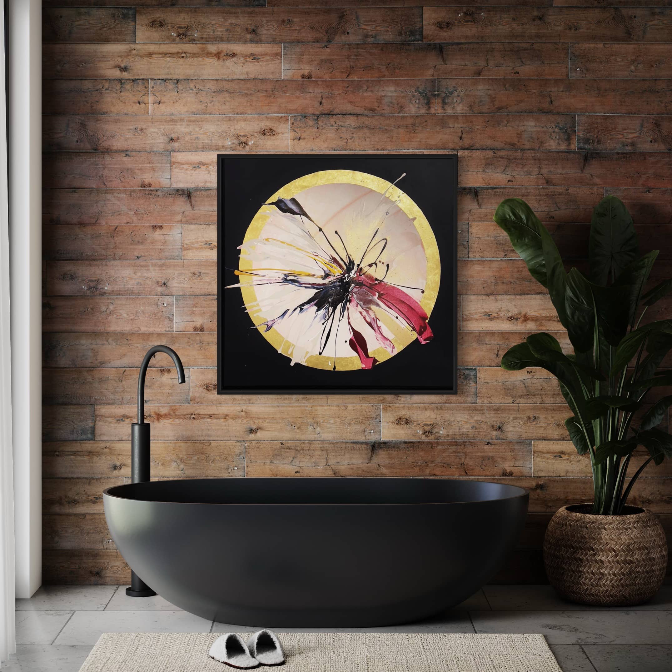 Modern bathroom with a dark freestanding tub, wood-paneled walls, the "Expansions" original painting by Kate Mayer adorned with acrylic and gold leaf, a potted plant, and a towel on the floor.