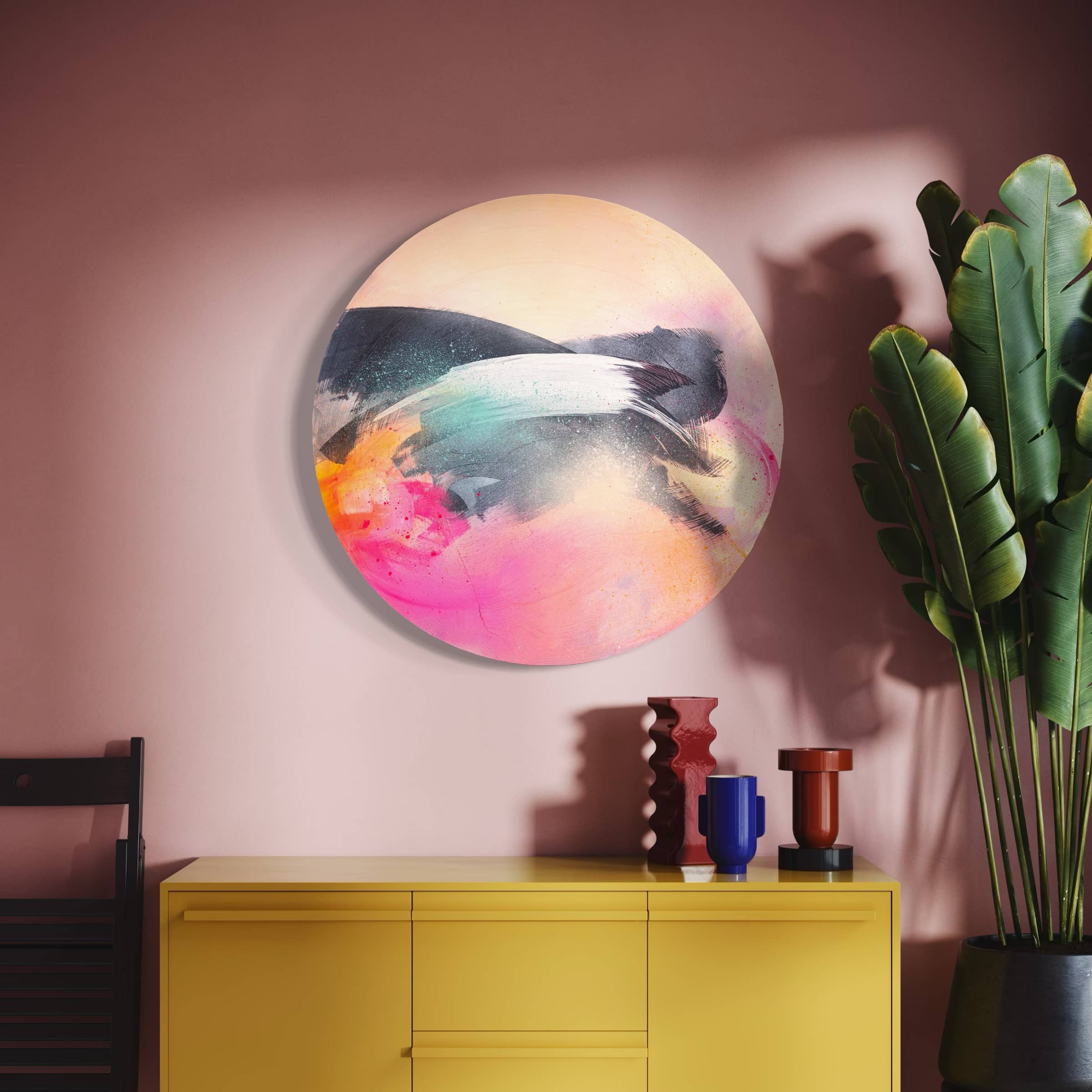 Glow Up," an abstract by Kate Mayer, crafted with acrylic and spray paint, adorns a pink wall above a yellow cabinet.