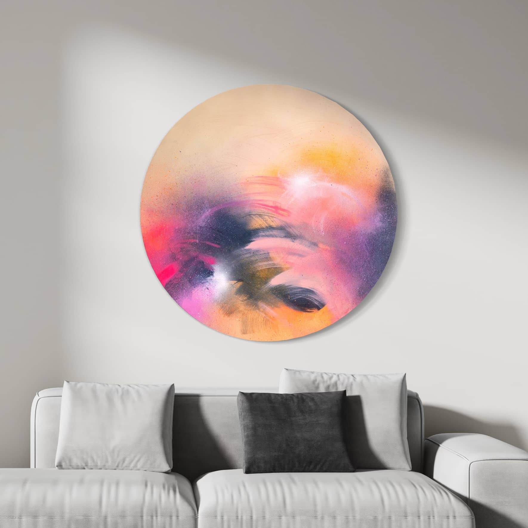 'A Star is Born' by Kate Mayer adorns the wall above a light gray sofa with cushions.