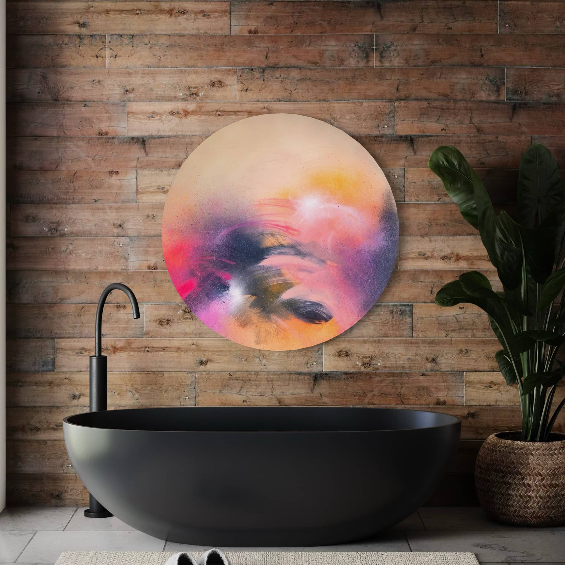 A modern bathroom with a black oval tub, wooden wall, "A Star is Born" by Kate Mayer, and a potted plant.