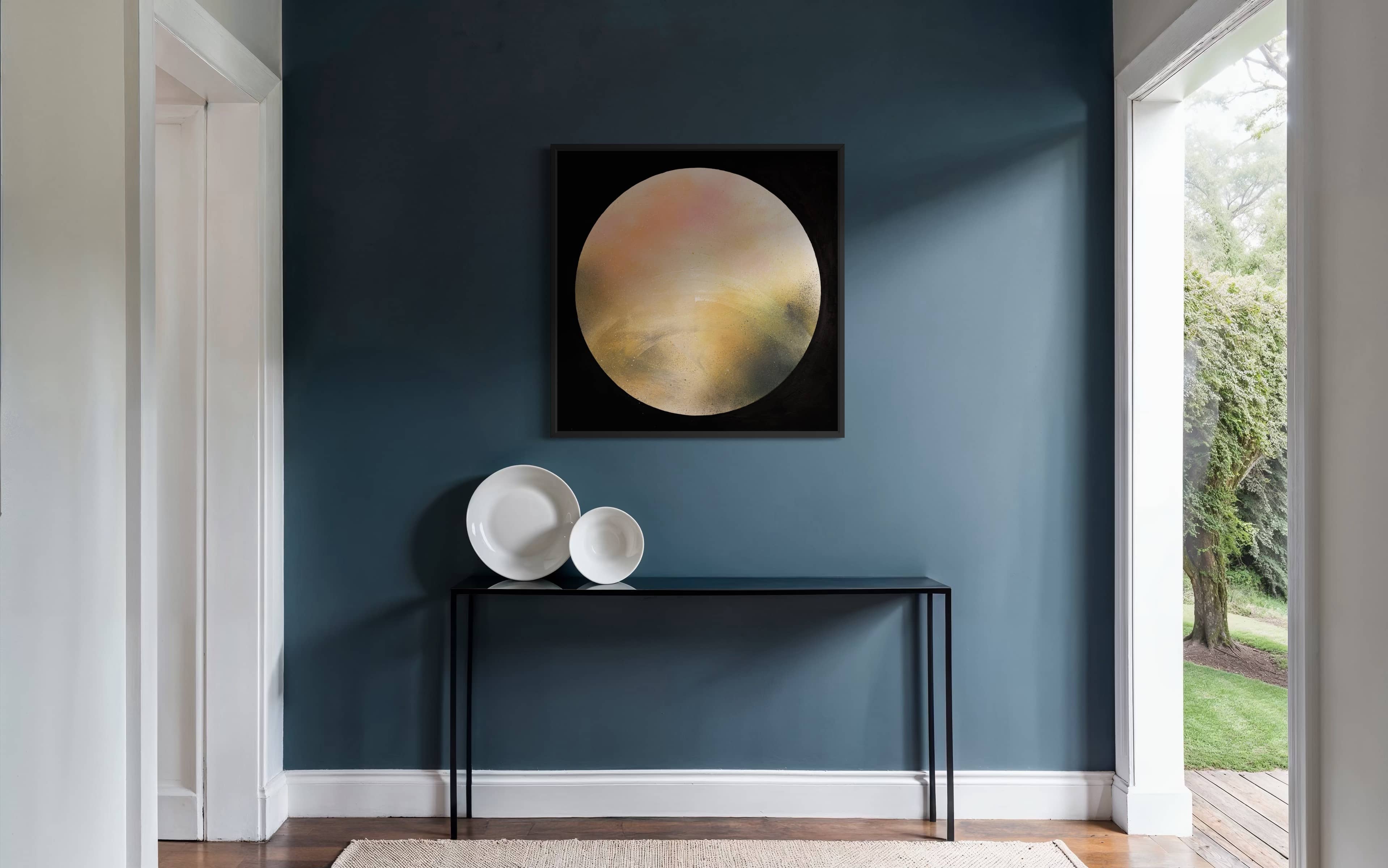 A modern hallway with a blue wall, Kate Mayer's Keep Time On Me art, a black console, and three white ceramic bowls.