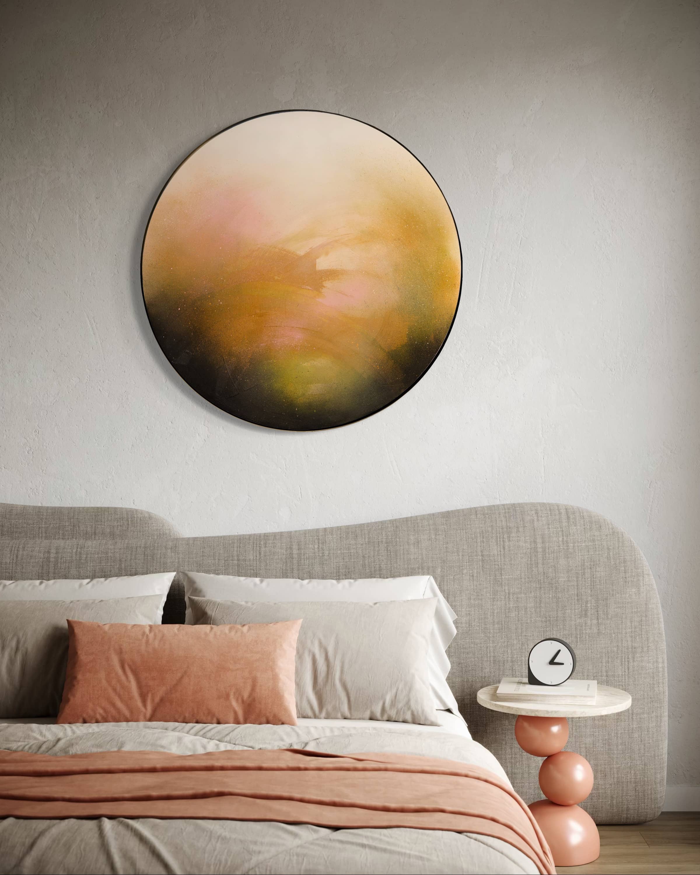 Modern bedroom featuring 'Only Now I See The Light' by Kate Mayer above the bed, pink pillows, and a table with a clock.