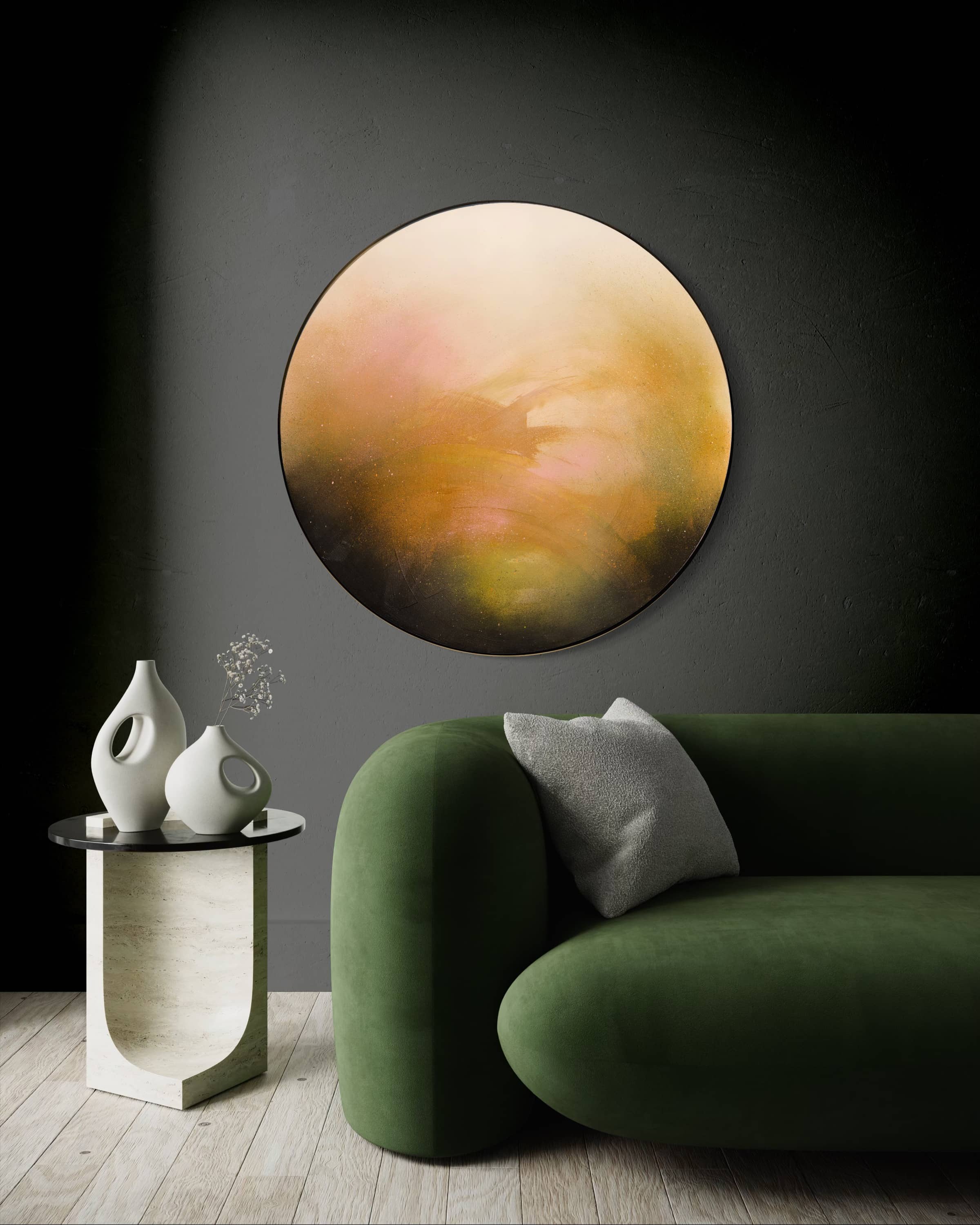 A green velvet sofa and table sit beneath Kate Mayer’s "Only Now I See The Light" on a round plywood panel.