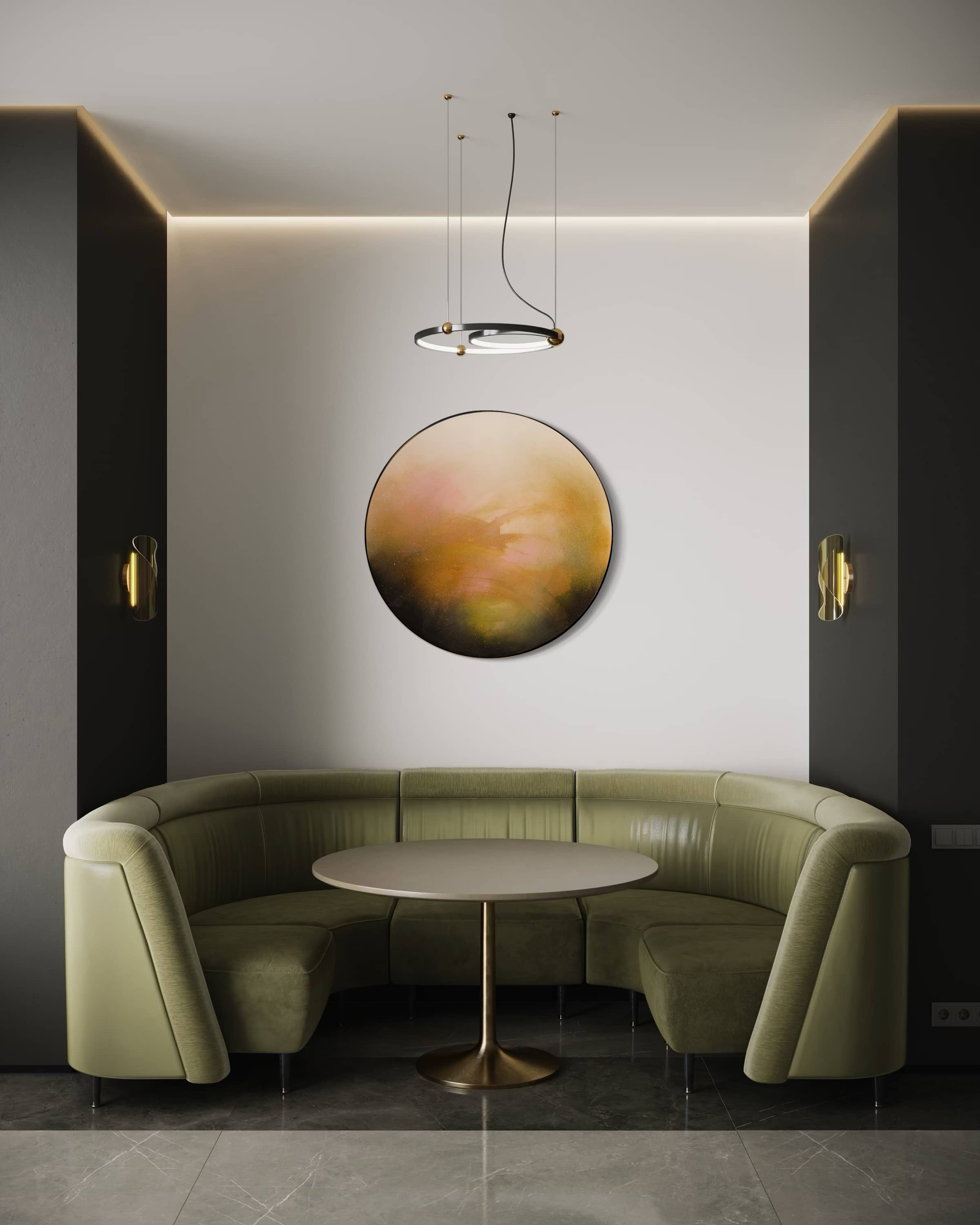 Modern corner seating with olive-green sofa, round table, and Kate Mayer's "Only Now I See The Light" pendant overhead.