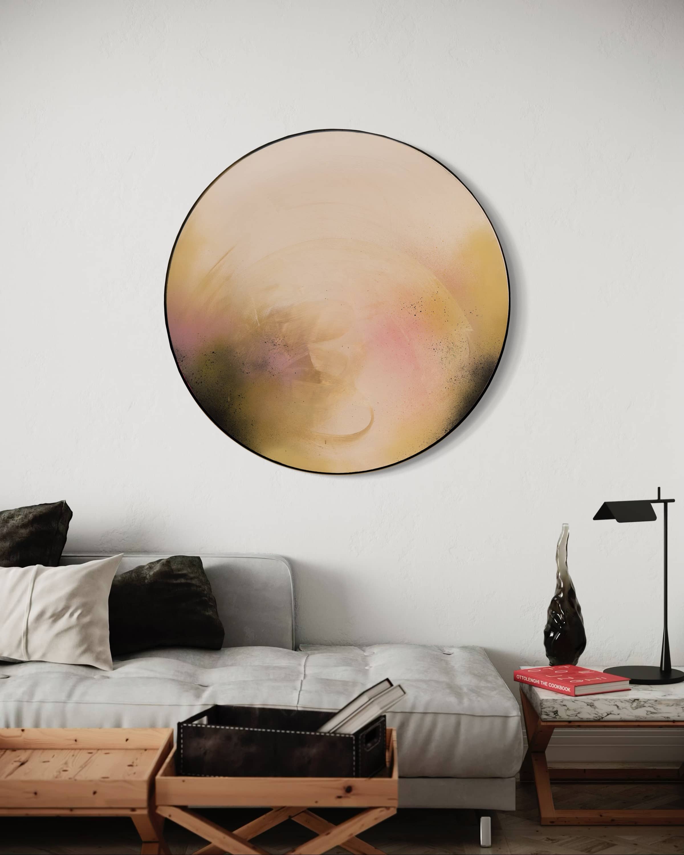 Kate Mayer’s "You Made The Moon Our Mirrorball" hangs above a modern gray sofa in this cozy living room.