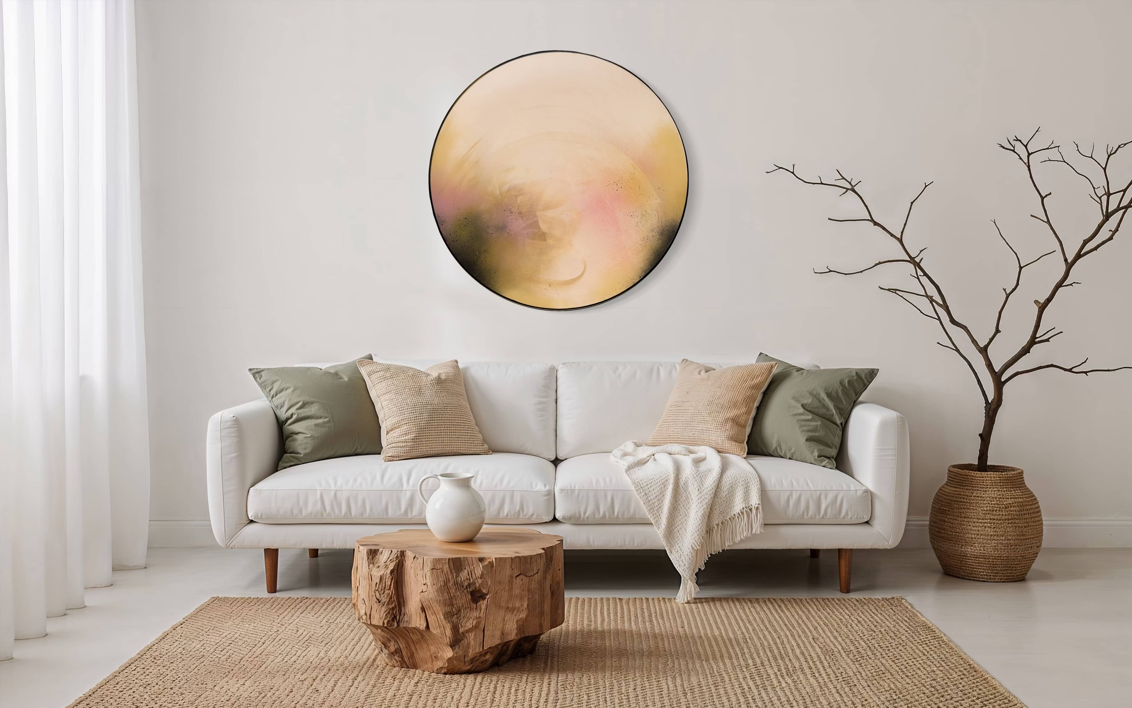 Modern living room with white sofa, neutral pillows, wood coffee table, and Kate Mayer’s “You Made The Moon Our Mirrorball.”.