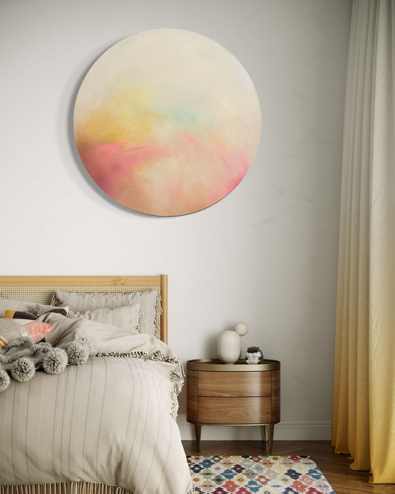 A cozy bedroom with The Afterglow of Connection by Kate Mayer, a wood nightstand, and beige textured bedding.
