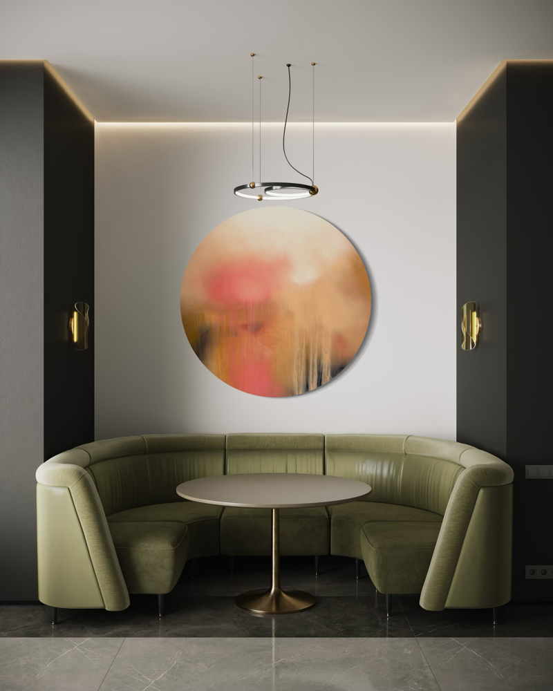 Curved green sofa, round table, and Kate Mayer’s The Afterglow of Awe painting create a chic nook with pendant light.