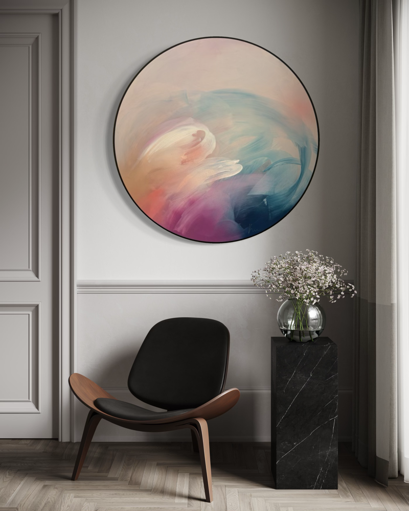 ‘For Every Mountain’ by Kate Mayer hangs above a black chair and marble pedestal in a modern room.
