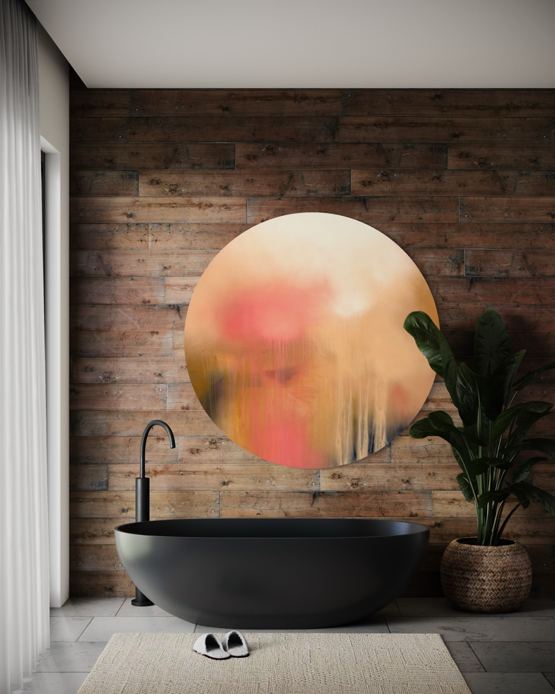 A modern bath with a black tub, wood wall, beige rug, and The Afterglow of Awe by Kate Mayer in a handmade metal frame.