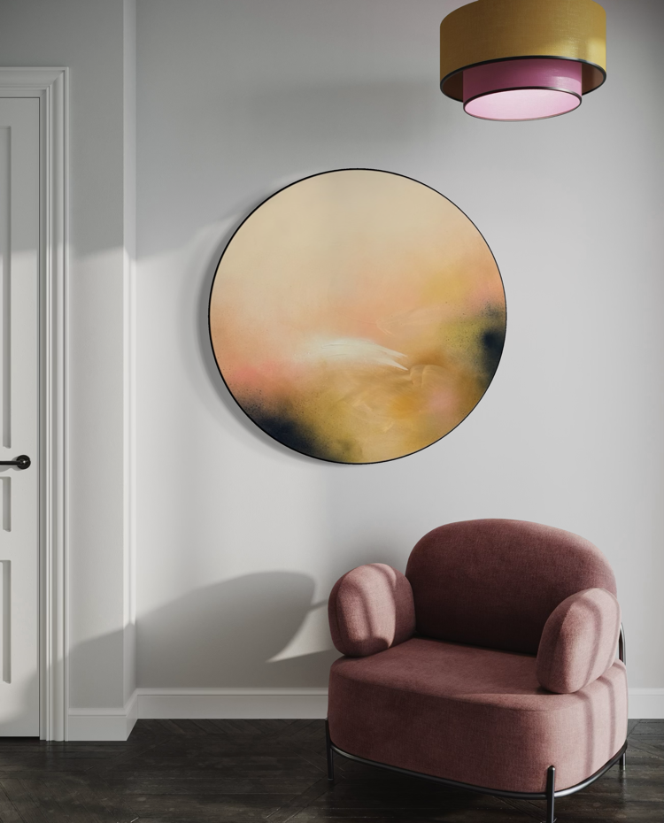Friend“ by Kate Mayer, a pastel abstract painting in a handmade metal float frame, hangs above a mauve armchair.