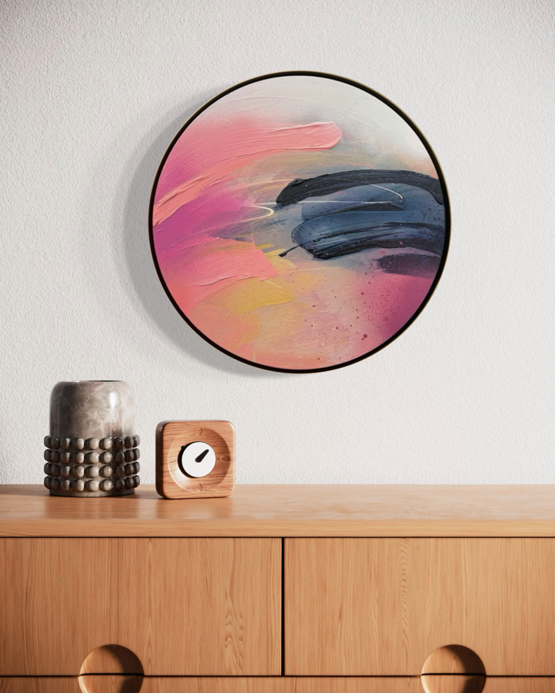 Looking For You“ by Kate Mayer: round acrylic on plywood in a handmade metal frame, displayed above a decorated dresser.