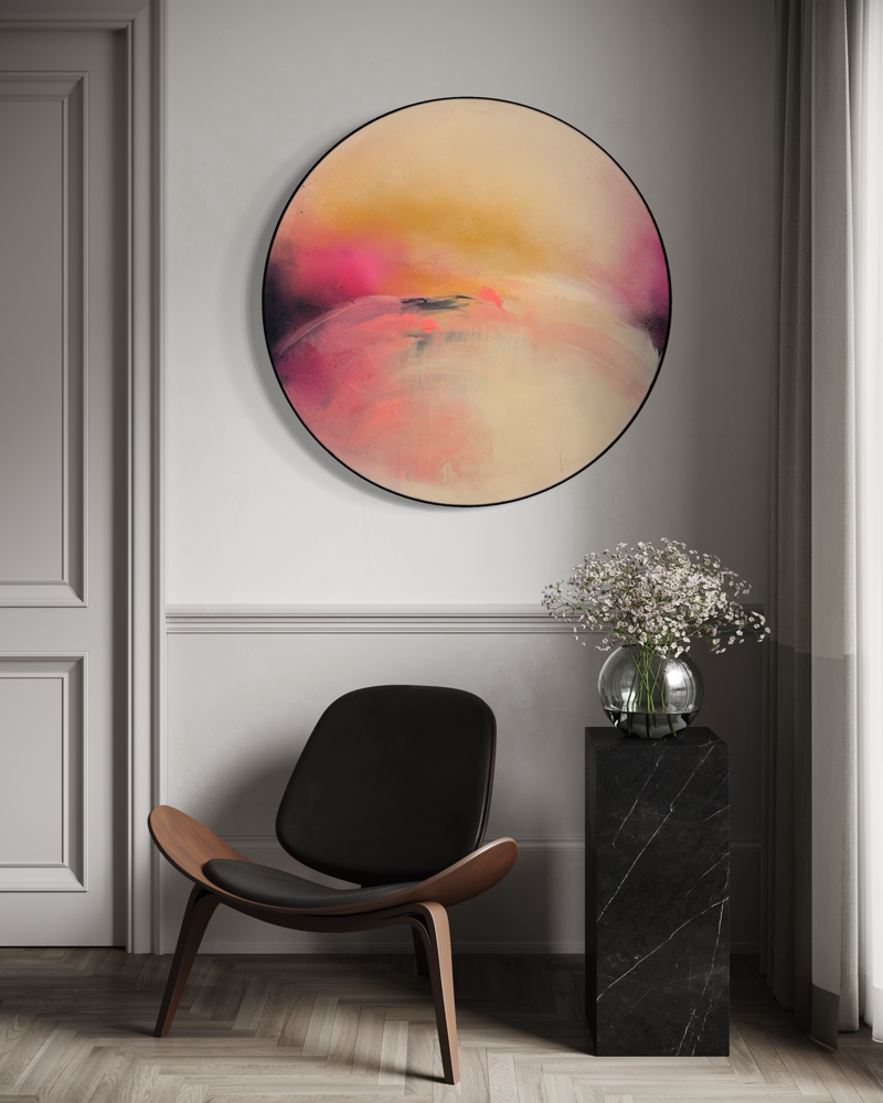 Modern room with a black chair, “Unfinished Sympathy” by Kate Mayer, and white flowers on a pedestal.