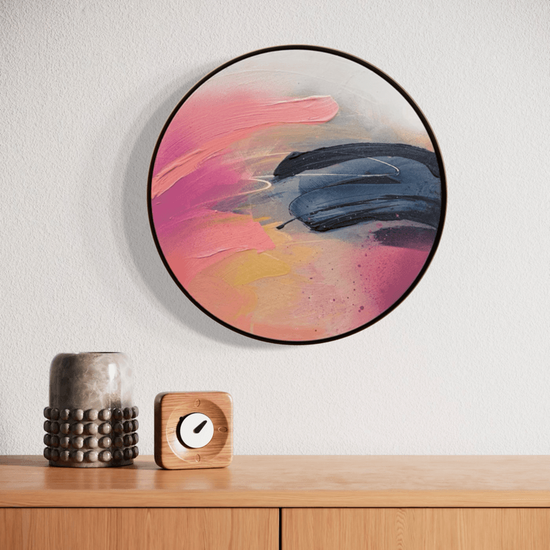 ‘Looking For You’ by Kate Mayer: round abstract painting in a handmade metal frame, pink/blue/beige above cabinet decor.