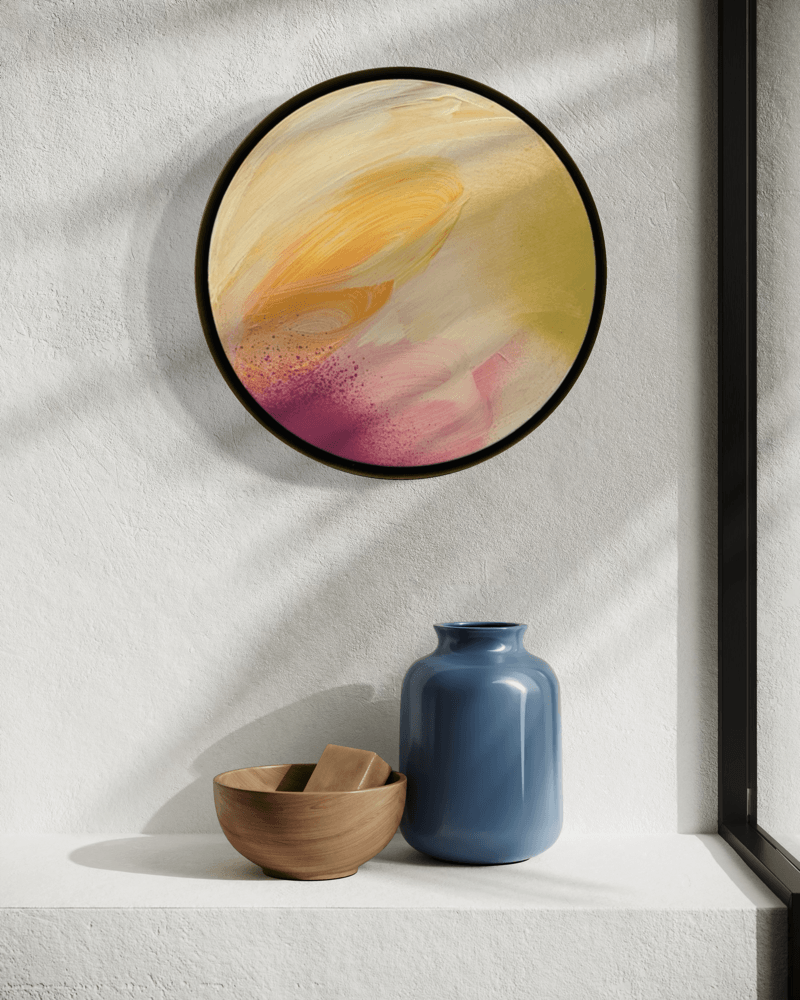 Lovely Day“ by Kate Mayer, in a handmade metal frame, above a blue vase and wooden bowl, lit by window light.