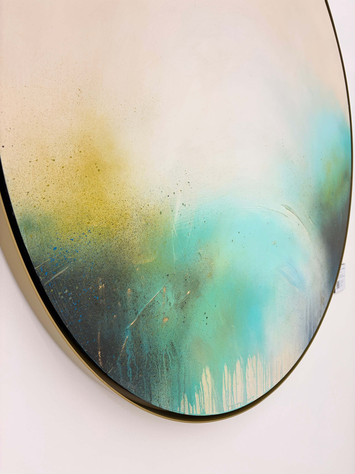 The Afterglow of Stillness by Kate Mayer, original abstract acrylic painting on plywood in teal, yellow, black and white, shown from the side.