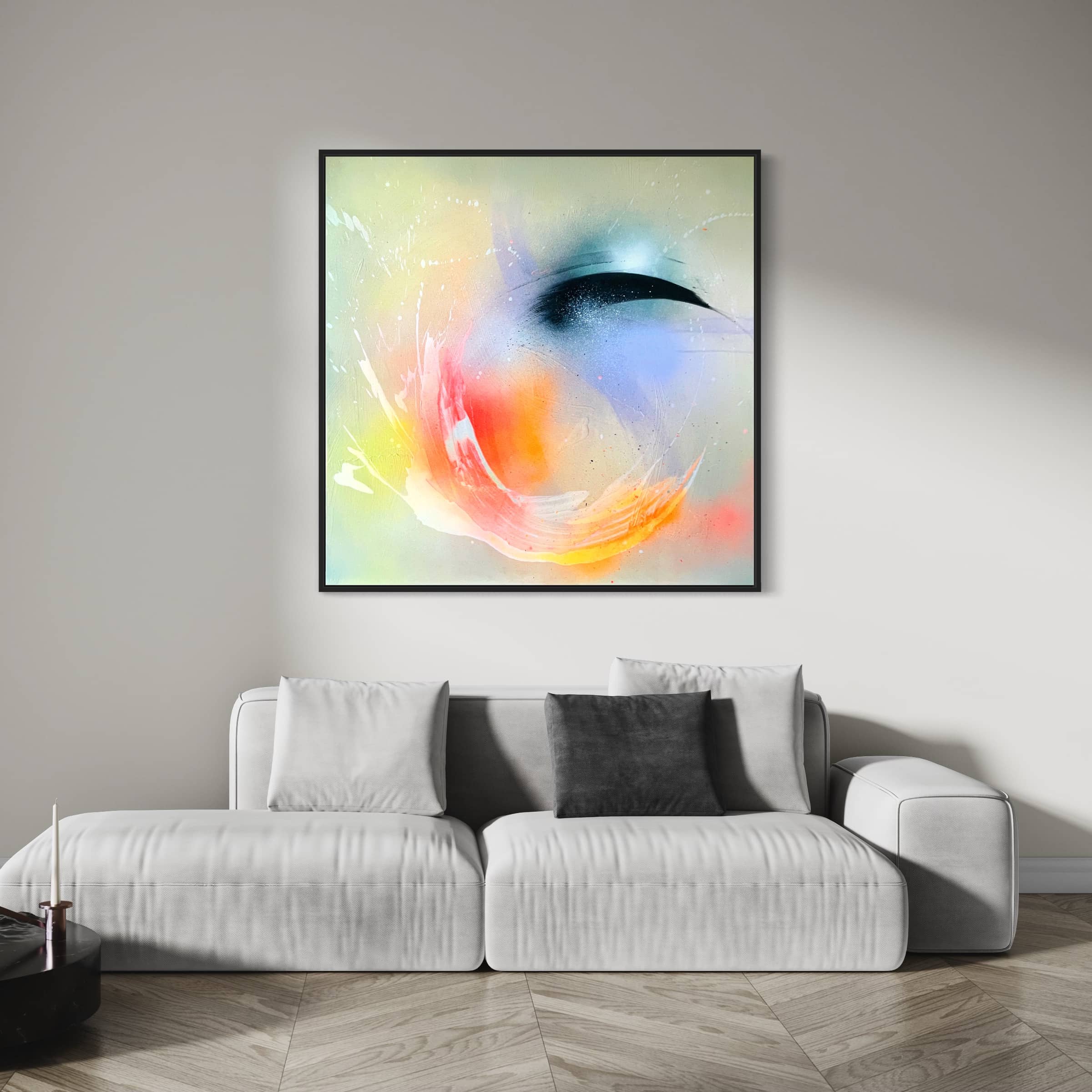 A minimalist living room features a white sofa, complemented by the eye-catching "Eternal Vitality" original painting by Kate Mayer, crafted using acrylic and spray paint.